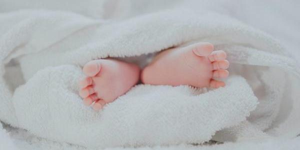 Baby's feet wrapped in towel