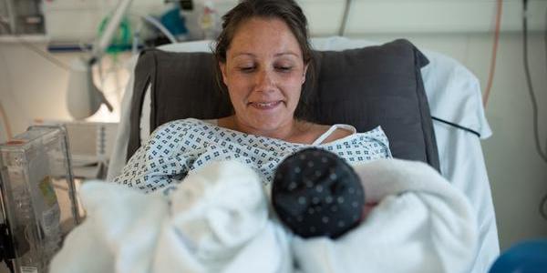 Mother in hospital with newborn twins