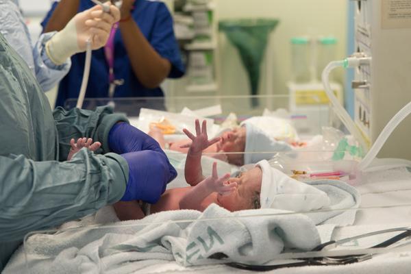 Two babies are treated in a NICU