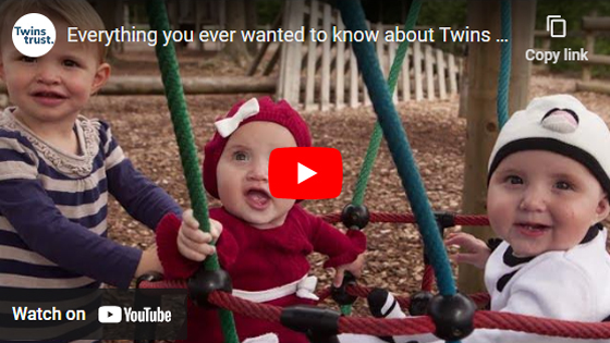 Title card of a YouTube video showing triplets playing on a swing