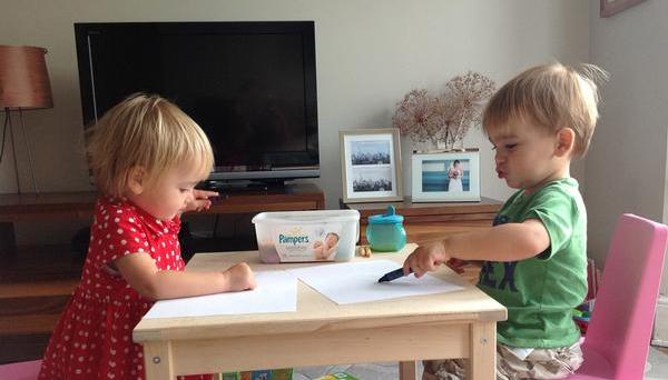 Twins drawing pictures