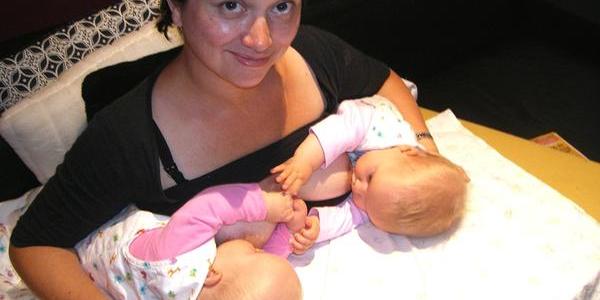 Woman breastfeeding twins