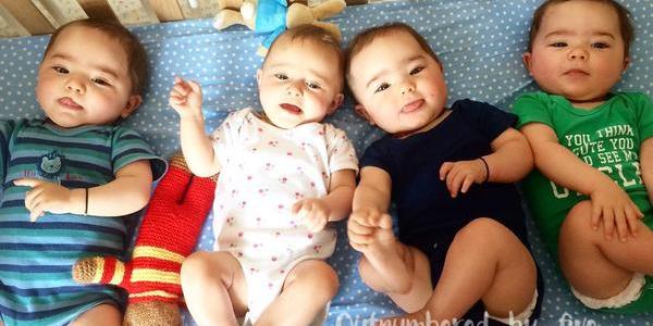 Quad babies in cot
