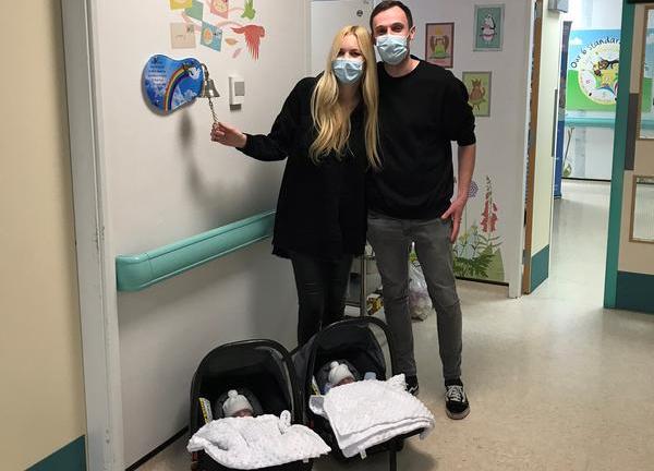 Twins leaving neonatal care and going home