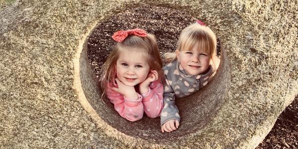 Twin girls playing outside
